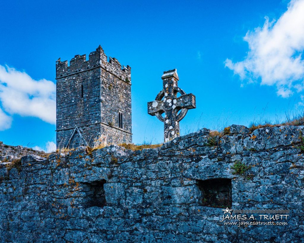 Bell tower and celtic cross at Clare Abbey.