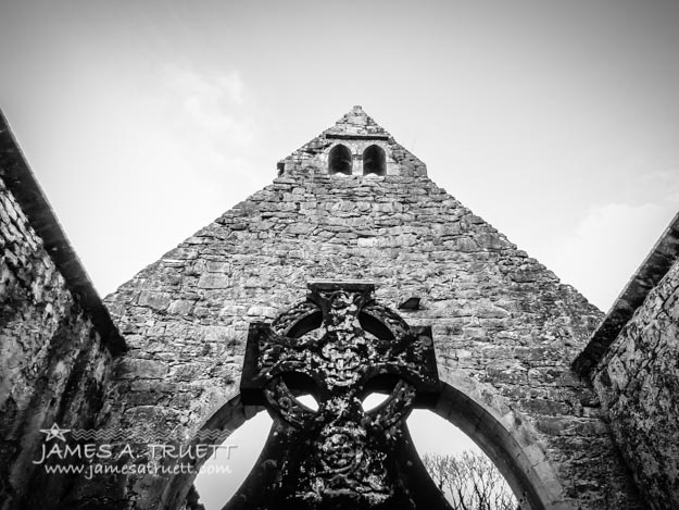 Celtic Cross inside Church Ruins in County Clare, Ireland